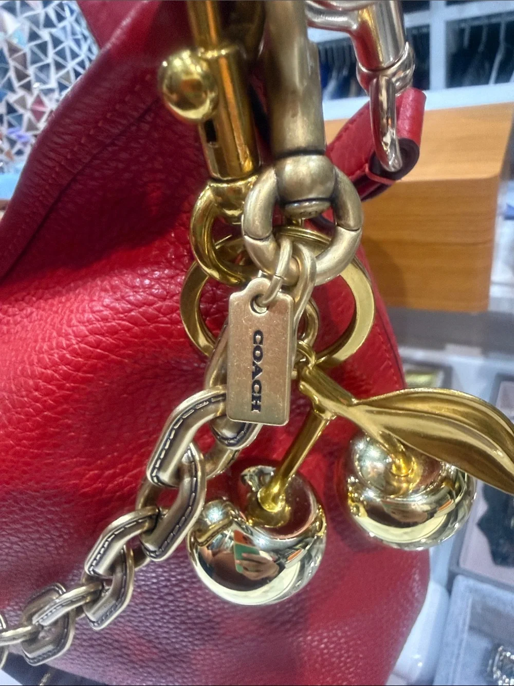 Coach Red Pebbled Leather Shoulder Bag and will include link chain & charm